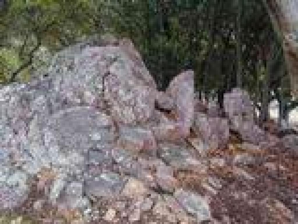 Pink rocks on the side of the fire road