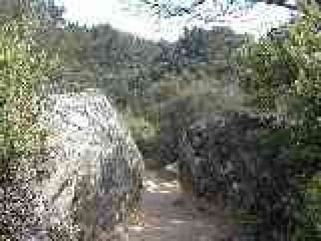 Squeezing through two boulders