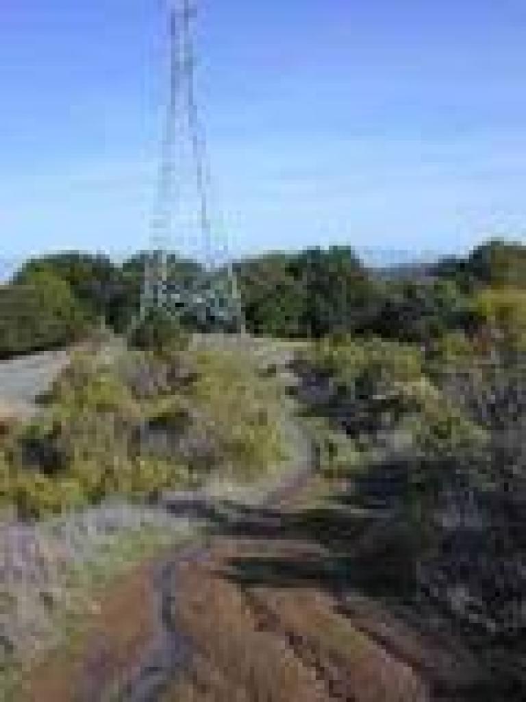 Trail passes a power tower