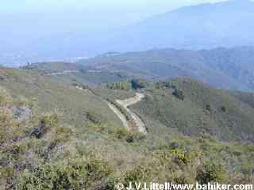 View downhill from the trail, revealing the descent