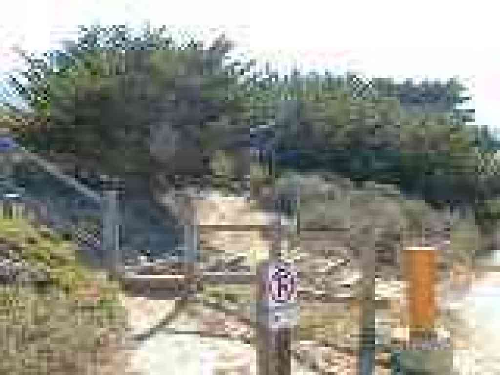 Information signboard sits off the trail