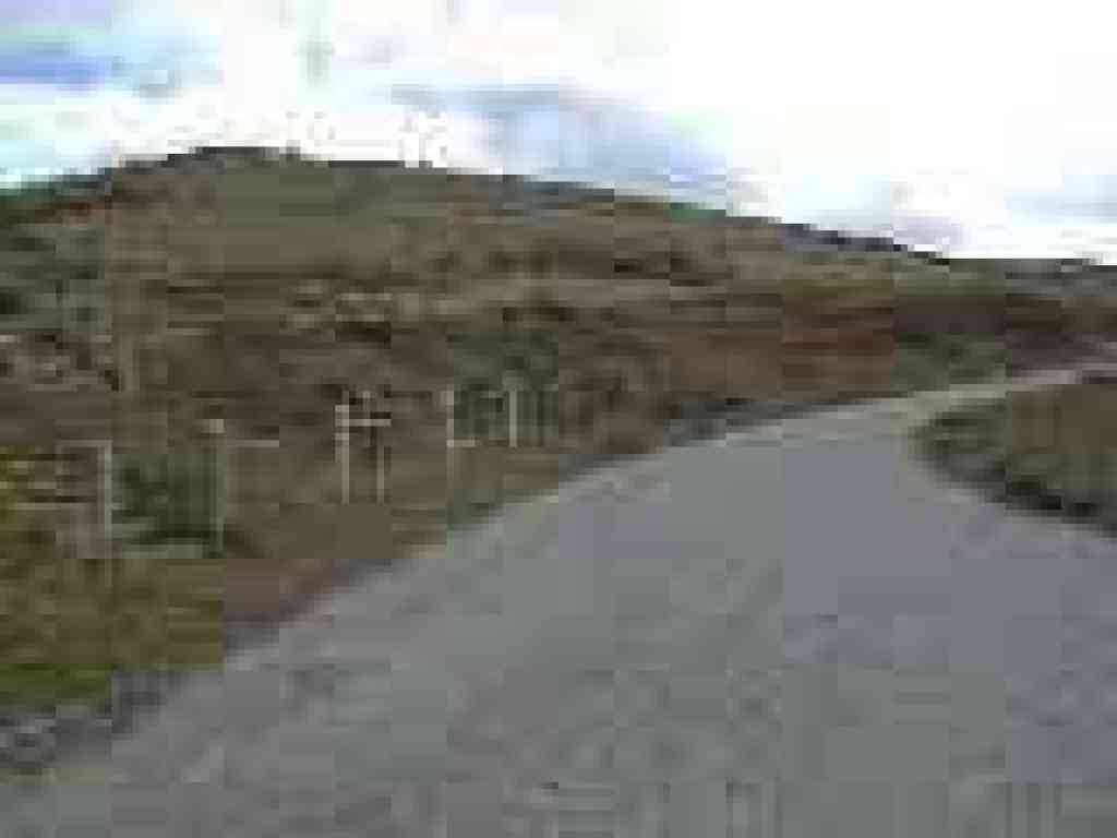 Head to the top on the road, or the path